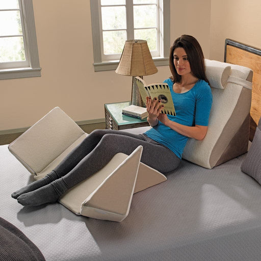 Women reading while supported by the ContourSleep Bed Wedge System