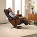 A man using the Circa Zero Gravity Swivel Chair by Human Touch in espresso | Relax The Back