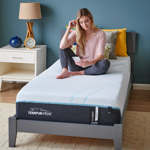 Woman laying on the TEMPUR-ProAdapt® 12" Medium Mattress